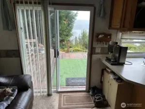 Slider leads out to your large deck, kitchen on right