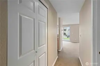 Hallway with great storage closets.