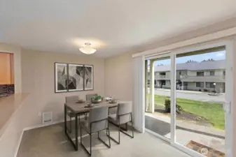 Dining area: private patio and storage unit located to the left of the patio. *Room is digitally staged to give you design inspiration!