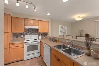 Upgraded kitchen has great storage, all appliances stay. *Decor digitally staged.