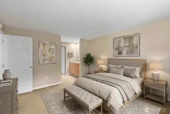 Primary bedroom from different viewpoint. Features sink/storage area and walk-in closet. *Decor is digitally staged.