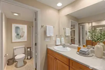 Full bath accessible from Primary bedroom or hallway. *Decor is digital.
