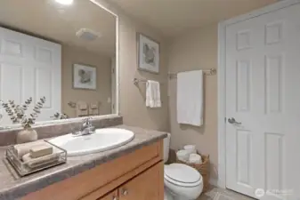 Main bath is separated into a half bath and then a full bath. *Decor is digitally staged.