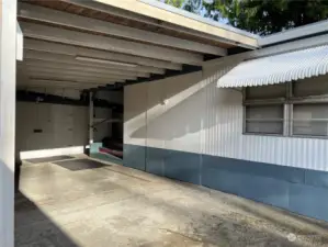 Spacious Carport and view of back secure storage area.