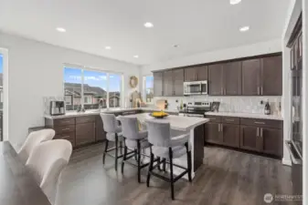 Stylish and spacious kitchen with island and stainless steel appliances