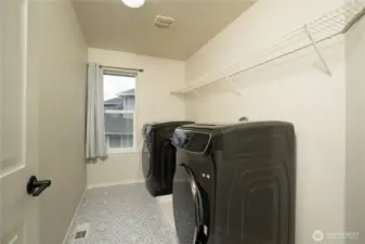 Upstairs utility room with newer w/d that are included.