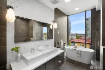 Primary bath features heated radiant floors, towel warmer, bidet, walk-in shower and a large soaking tub.