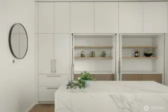 Paneled Miele SMARTGLAS refrigerator with custom doors that roll back for an open or closed sleek look.