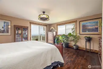 Primary bedroom with deck and view.