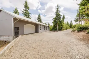 Side and rear exterior views highlighting natural lot setting.