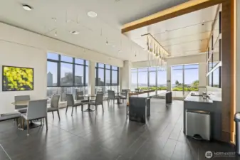 Relax or work in the Sky Lounge featuring cozy seating, workstations, kitchen/bar, and TV