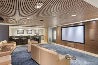 Host movie nights in the expansive screening room, complete with kitchen and bar area—easy to reserve for private use.