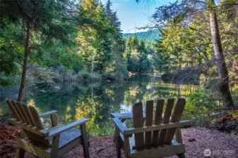 Peaceful lakeside seating area just minutes’ hike from the property.