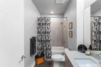 The main bath has a deep tub and tile surround. Both toilets in the condo are elongated, high-boy with soft closing lids... NO SLAMMING LIDS!