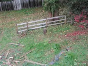 Lower part of yard, beyond fence are the trails