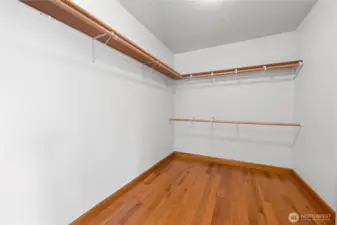 Primary bedroom walk in closet
