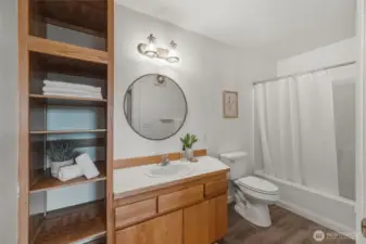 There is linen storage in the full bath at the primary suite.