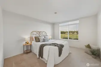 The primary bedroom is also south-facing and spacious.