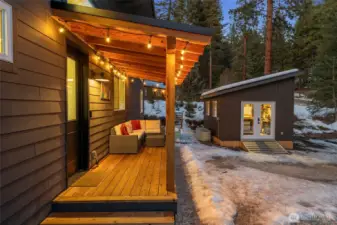 Built in 2025, the front outbuilding includes French doors, 2 36"x36" double-pane windows, and an 11' sidewall for vertical storage. Complete with interior lighting & outlets it’s perfect as a gear room, future bunkhouse or home office.