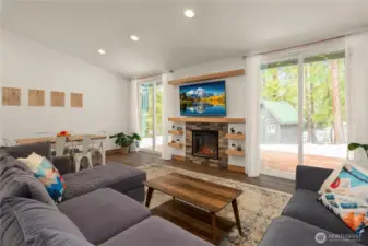 Oversized dual glass sliders off the great room open to the back deck, ideal for BBQs or relaxing in peaceful seclusion.