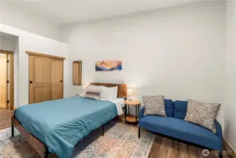 Vaulted ceilings and dual closets highlight the primary suite, complete with peaceful backyard views.