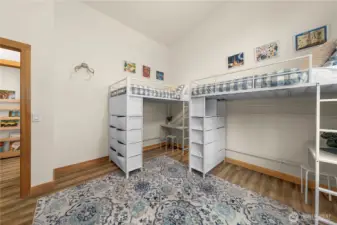 Bedroom 3 features a soaring 15' vaulted ceiling, full-size closet, and abundant natural light.