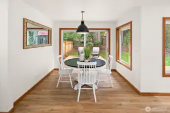 The breakfast nook opens to another relaxation area on the expansive deck!