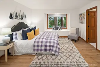 One of the secondary bedrooms with a window seat and en-suite Jack-n-Jill full bath!