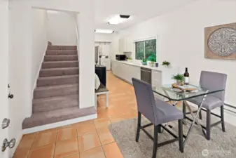 Welcoming entry with an eating nook and stairway to the upstairs bedroom.