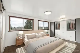 Primary Suite: Spacious primary suite on the main floor, thoughtfully updated for comfort and maximum natural light.