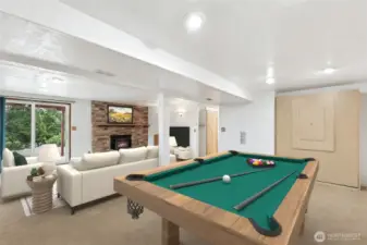 Finished walk-out basement with office nook, recreation room, and a built-in Murphy bed with drop-down  sleeping space.