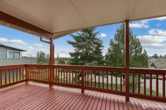 Large wrap-around entertainment deck with views of Puget Sound and the Olympic Mountains in Des Moines, WA.