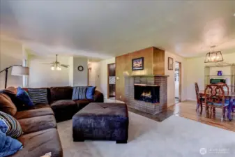 Spacious living room with wood burning fireplace