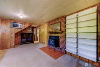Lower level family room with wood-burning insert stove
