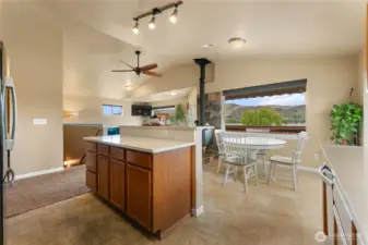 Kitchen with newly added Quartz countertops and tile flooring. Lakeview from kitchen, dining table and Island.