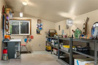 Workshop off of the south end of the garage, there is a wall seperating it from the garage with its own entry