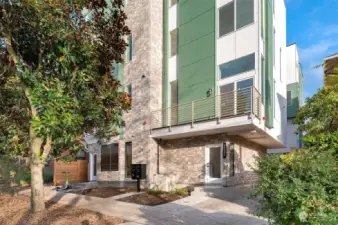 Welcome to The Olive Collection by Greencity Homes! This modern entryway invites you into a home designed with thoughtful details, nestled on a serene residential street yet steps away from Capitol Hill’s vibrant lifestyle.
