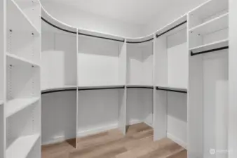 Say goodbye to clutter with this custom-designed walk-in closet offering plenty of storage and organization space. A dream come true for any wardrobe.
