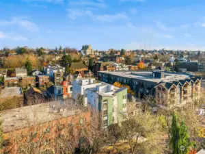 Experience urban tranquility with this expansive rooftop perspective, capturing a lively and diverse architectural landscape.