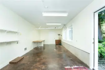 Spacious lower level finished area with exterior entrance.  Gym, Sauna, craft room, or additional living space.