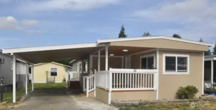 Step into the home through a lovely patio entrance, just off the covered carport—offering both charm and everyday convenience.