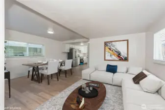 Bright, open-concept living area designed for comfort, connection, and effortless entertaining. Featuring durable and stylish vinyl plank flooring throughout, combining easy maintenance with modern appeal