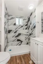 a second full bathroom with shower, providing added convenience for guests and household members.