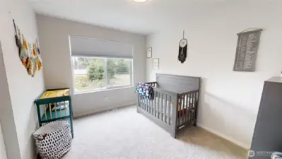 Bedroom with window towards front of home.