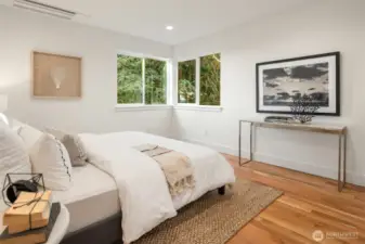 The primary bedroom on the upper level comes complete with water views!