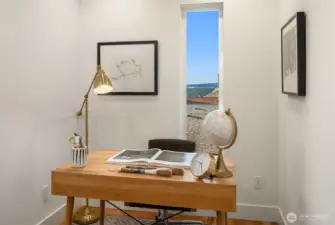 A small office nook with Sound views adds function without sacrificing flow, and a laundry closet on the same level as the primary suite makes daily life even easier.