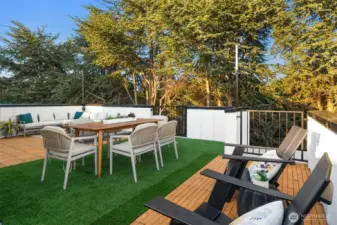 Atop it all, the expansive rooftop deck is your private outdoor oasis—complete with pet-friendly turf, real wood deck tiles, and pre-installed lighting to enjoy the panoramic views of Puget Sound, Alki Beach, the Olympic Mountains, and ferries gliding by.