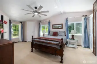 Generously sized primary bedroom has it's own ceiling fan