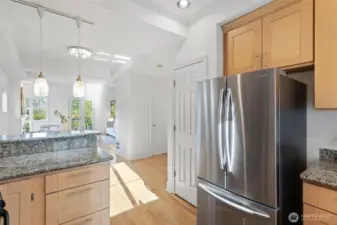 From the kitchen looking out is a wide-open floorplan with freshly painted interior.