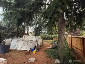 Very large back yard with access from a road to build ADU or garage/shop etc.